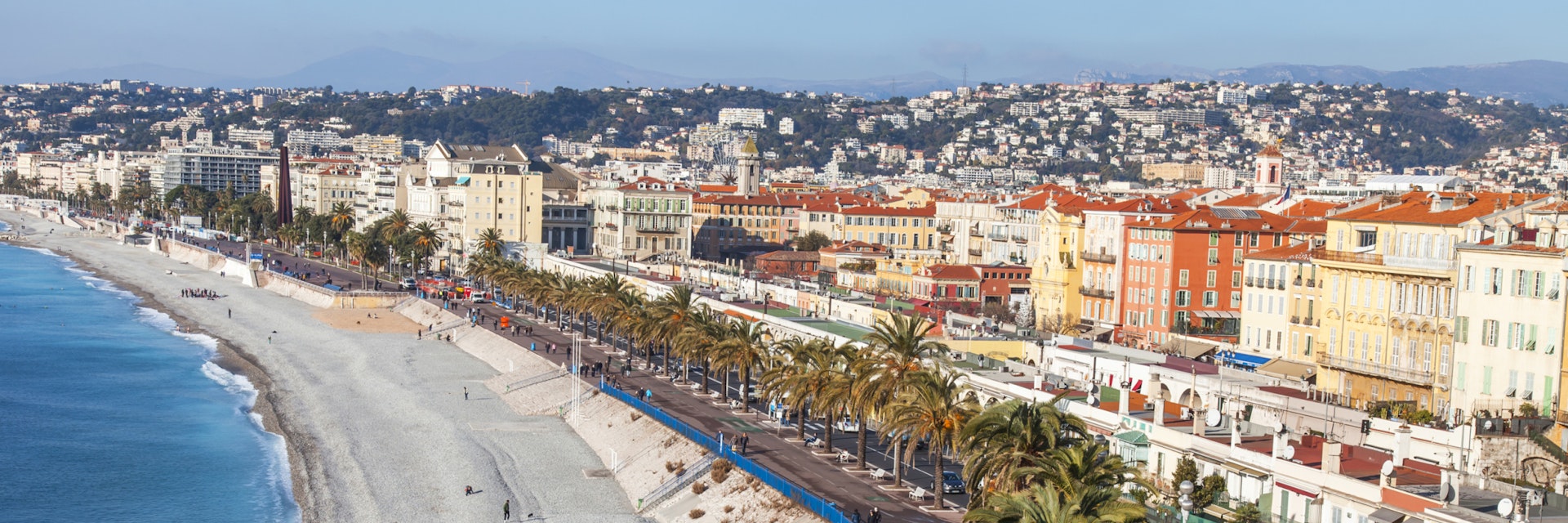 NICE, FRANCE, on JANUARY 9, 2017. Promenade des Anglais - the main embankment of the city, one of the most beautiful in the world, stretches along the sea and the beach. Aerial view from Shatto's hill; Shutterstock ID 613405820; Your name (First / Last): Daniel Fahey; GL account no.: 65050; Netsuite department name: Online Editorial; Full Product or Project name including edition: Nice and Graz POIs
