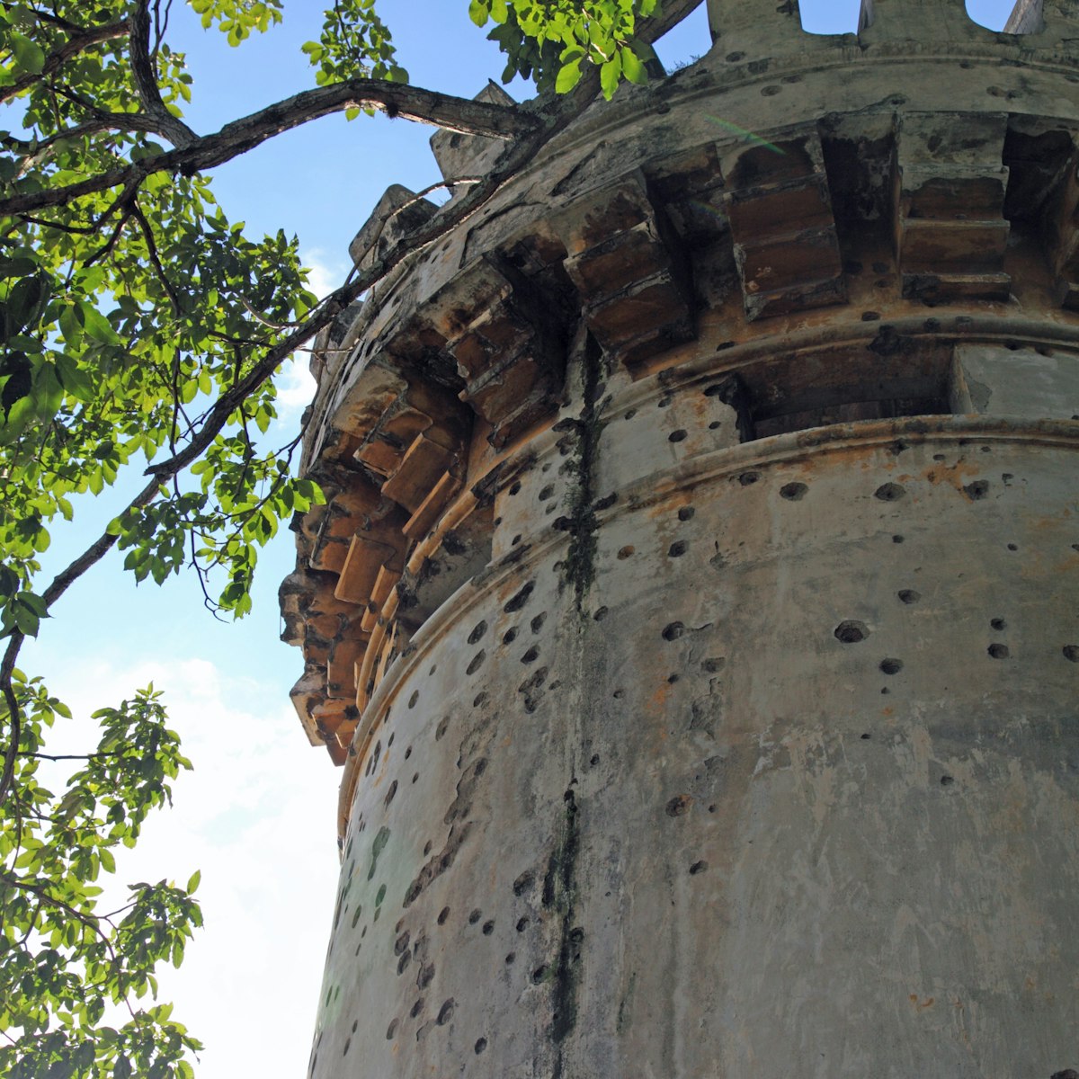 Spanish colonial era tower with battlements and multiple bullet holes, National Museum of Costa Rica.