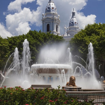 USA, Puerto Rico, Ponce, Fountain of Lions with Ponce Cathedral built in 1670 in background