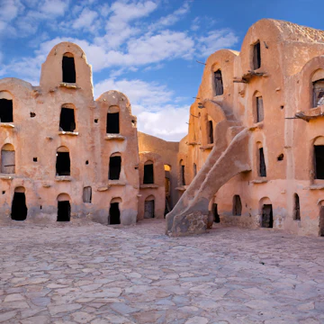 Ksar Ouled Soltane is a fortified granary, or ksar, located in the Tataouine district in southern Tunisia. The ksar is spread out over two courtyards, each of which has a perimeter of multi-story vaulted granary cellars, or ghorfas. Like other ksour (plural of ksar) created by North African Berber communities, Ksar Ouled Soltane is located on a hilltop, to help protect it from raiding parties in previous centuries.