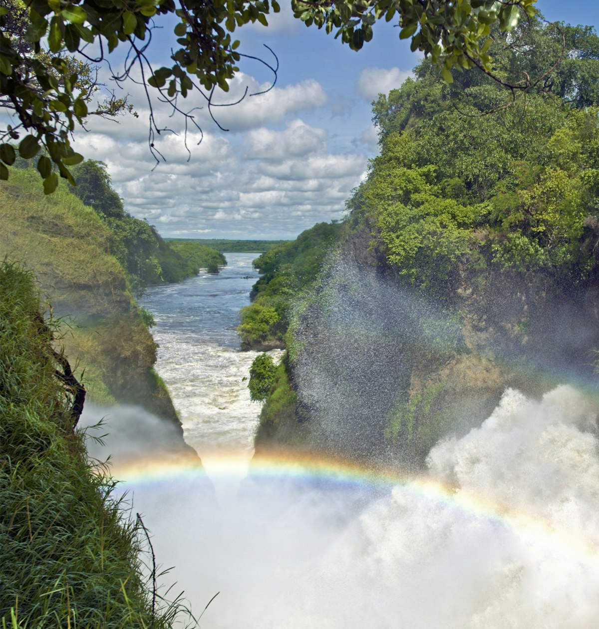 A rainbow arches over the spectacular Murchison Falls, Uganda, Africa