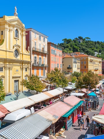 NICE, FRANCE - AUGUST 23, 2014: View of Cours Saleya - large pedestrian area famous for its flower, vegetable, spice and fish markets is one of the most popular places in Nice.; Shutterstock ID 264711230