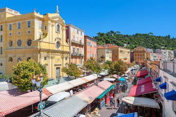 NICE, FRANCE - AUGUST 23, 2014: View of Cours Saleya - large pedestrian area famous for its flower, vegetable, spice and fish markets is one of the most popular places in Nice.; Shutterstock ID 264711230