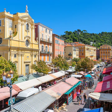 NICE, FRANCE - AUGUST 23, 2014: View of Cours Saleya - large pedestrian area famous for its flower, vegetable, spice and fish markets is one of the most popular places in Nice.; Shutterstock ID 264711230