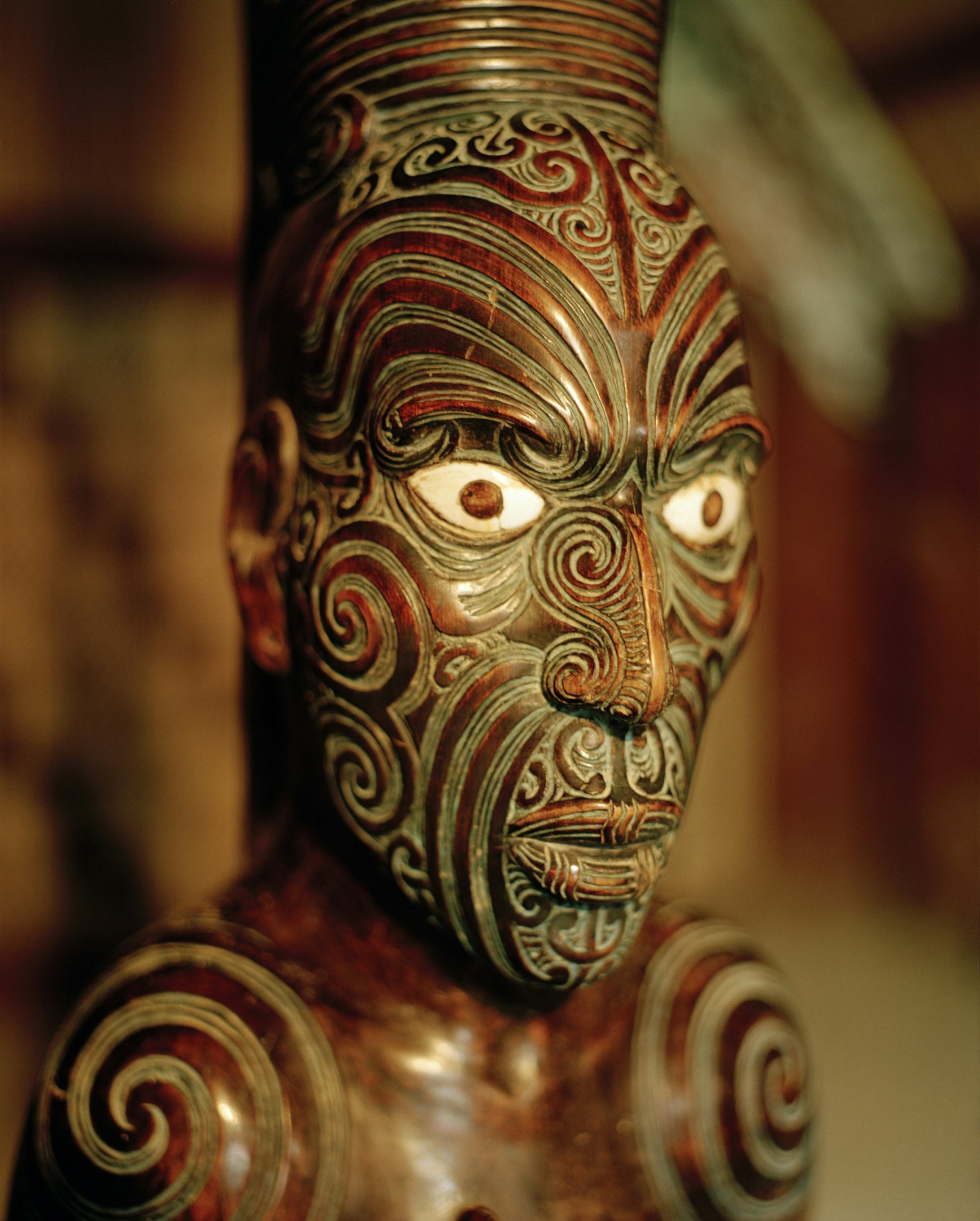 Carved figure on main pole at marae meeting house, Maori and Colonial Museum, Okains Bay, Banks Peninsula, South Island, New Zealand