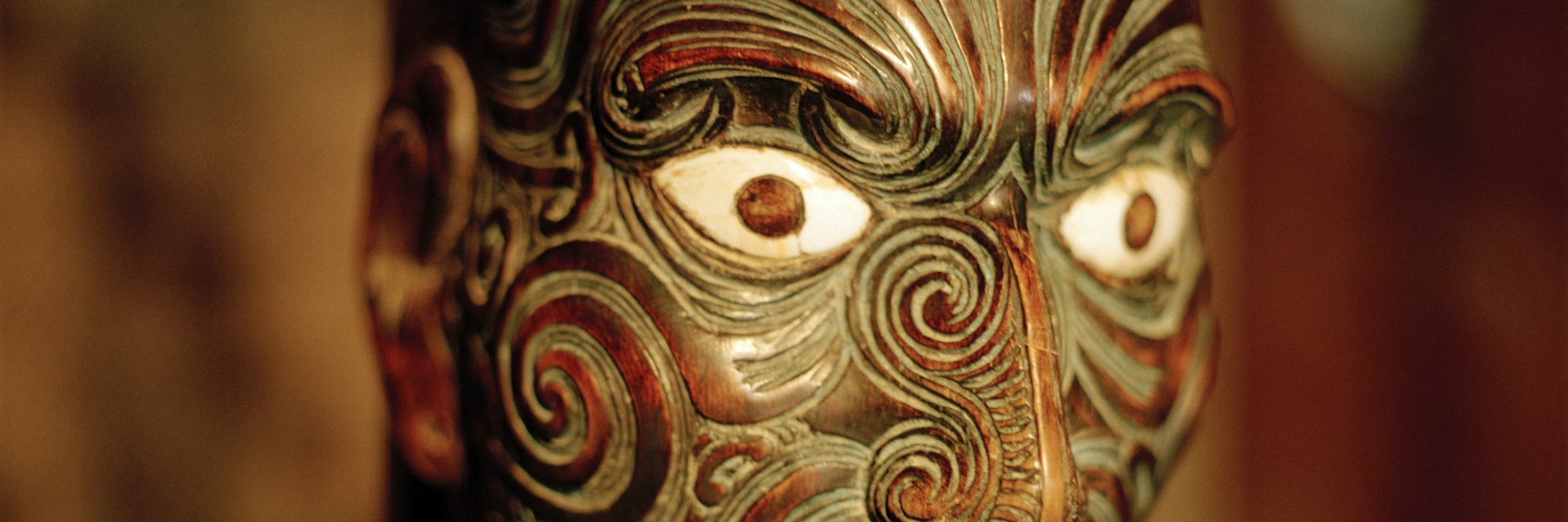 Carved figure on main pole at marae meeting house, Maori and Colonial Museum, Okains Bay, Banks Peninsula, South Island, New Zealand
