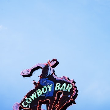 Neon sign above Million Dollar Cowboy Bar.