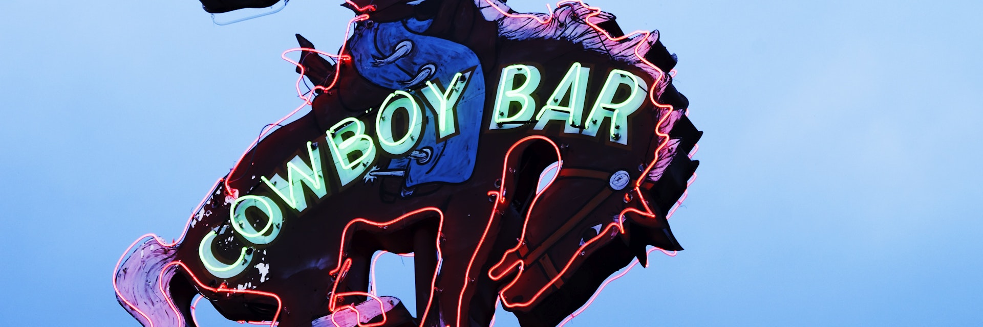 Neon sign above Million Dollar Cowboy Bar.