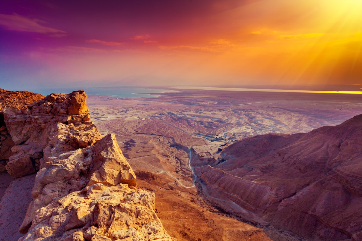 Beautiful sunrise over Masada fortress. Ruins of King Herod's palace in Judaean Desert.; Shutterstock ID 360569009; Your name (First / Last): Lauren Keith; GL account no.: 65050; Netsuite department name: Online Editorial; Full Product or Project name including edition: Israel Update 2017