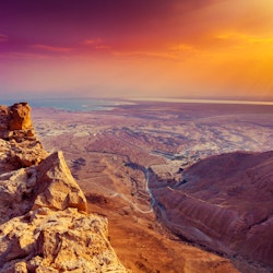 Beautiful sunrise over Masada fortress. Ruins of King Herod's palace in Judaean Desert.; Shutterstock ID 360569009; Your name (First / Last): Lauren Keith; GL account no.: 65050; Netsuite department name: Online Editorial; Full Product or Project name including edition: Israel Update 2017