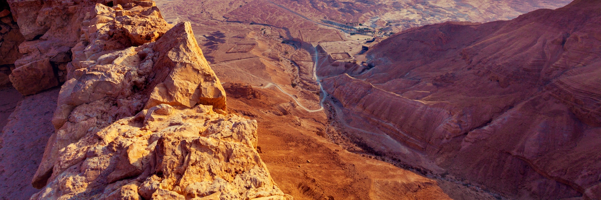 Beautiful sunrise over Masada fortress. Ruins of King Herod's palace in Judaean Desert.; Shutterstock ID 360569009; Your name (First / Last): Lauren Keith; GL account no.: 65050; Netsuite department name: Online Editorial; Full Product or Project name including edition: Israel Update 2017