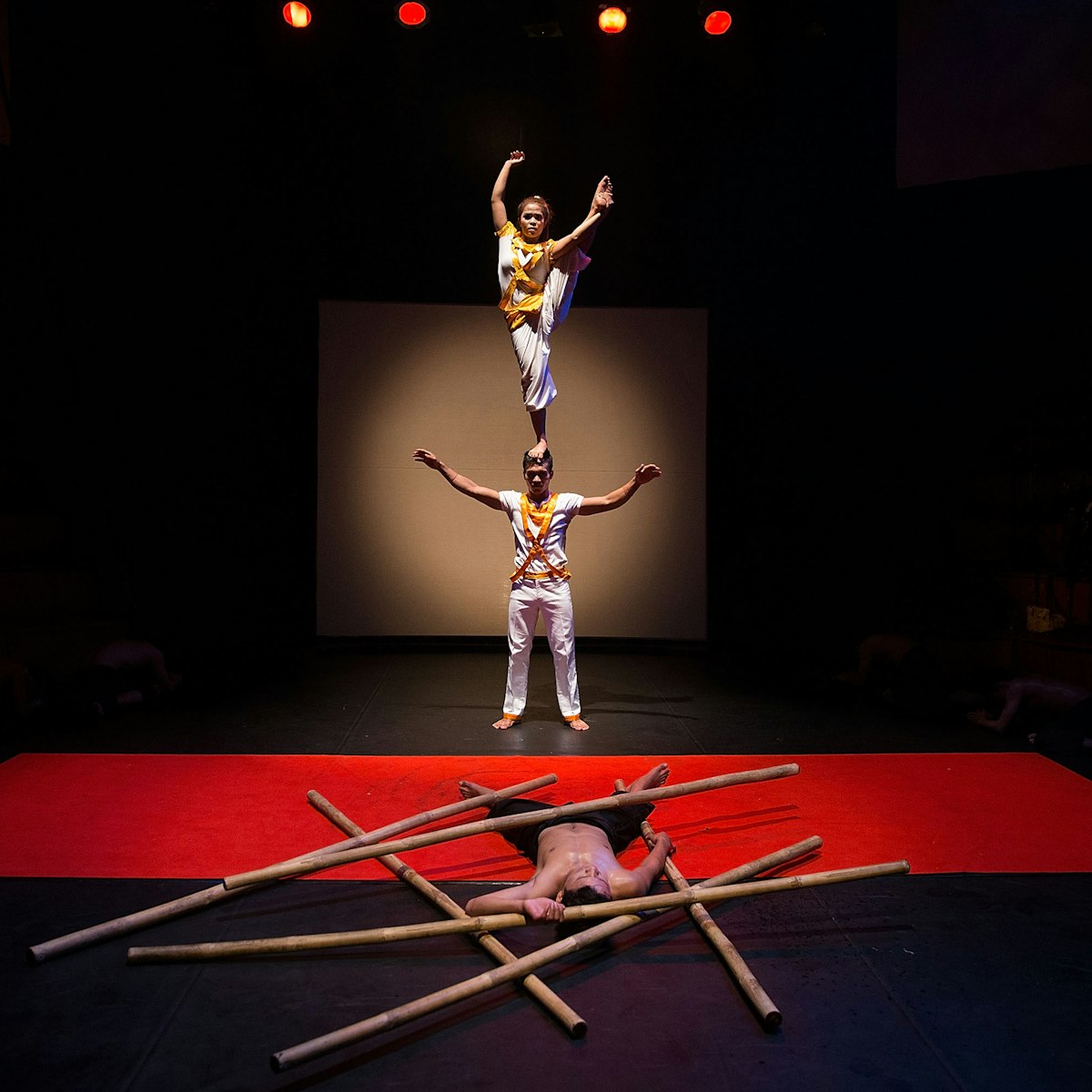 SIEM REAP, CAMBODIA - JULY 01:  Cambodian circus artists perform in front of a crowd of foreign tourists on July 1, 2015 during a performance of "Eclipse" at Phare - The Cambodian Circus in Siem Reap, Cambodia. Phare Ponleu Salpak is an organization providing free education and artistic training to Cambodian children. Students in the organization's circus program often go on to careers performing both internationally and domestically at venues like Phare - The Cambodian Circus in Siem Reap.  (Photo by Taylor Weidman/Getty Images)