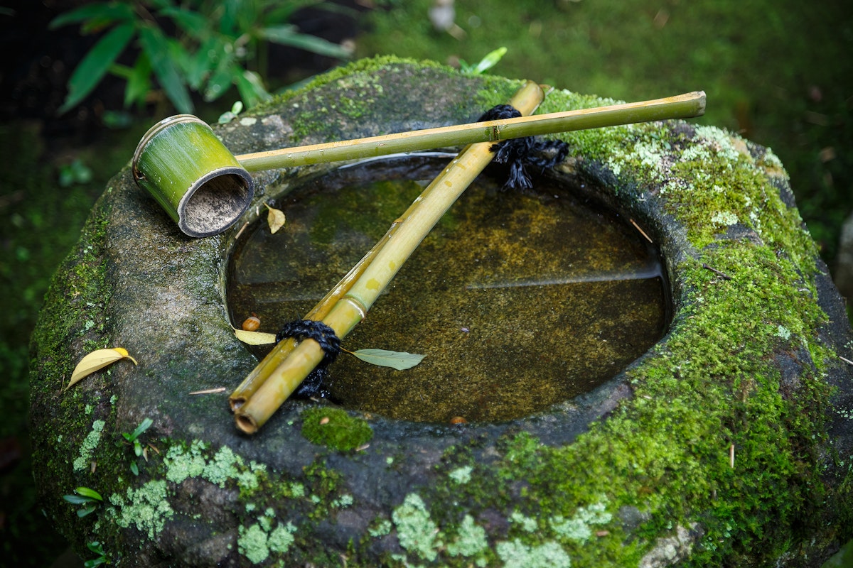 Water dipper on a stone basin in a Japanese Garden