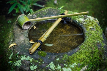 Water dipper on a stone basin in a Japanese Garden