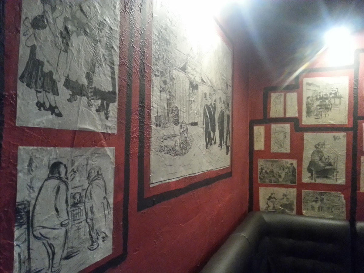 Walls adorned with drawings from a Heinrich Zille book at Starka Restaurant and Vodka