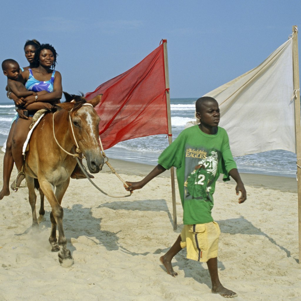 Ghana, Greater Accra, Accra. Labadi beach is Accra's premiere beach - horse rides are one of the attractions.