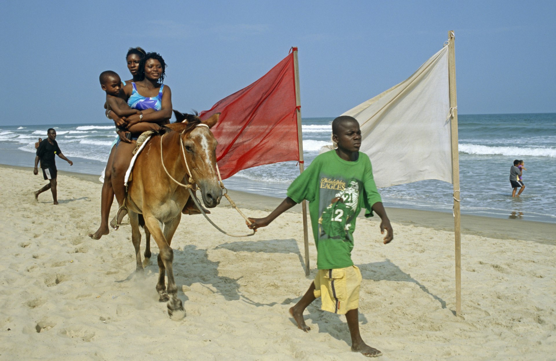 Families enjoying the sand at Labadi Beach in Accra