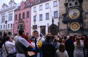 Tourists watching statues of the 12 apostles giving an hourly performance at Orloj (Old Town Hall).