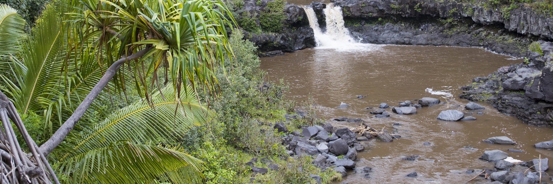 The pools of Oheo Gulch tinted brown due to an upcountry landslide and closed for swimming due to flash floods – requested pic was for swimmers in the pools. East Maui, beyond Hana.