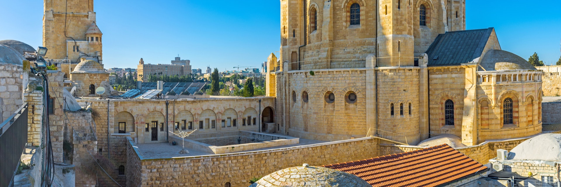 The house roofs are the best viewpoint, overlooking the huge building of the Dormition Abbey, with its clock tower and tiny belfries, Jerusalem, Israel.