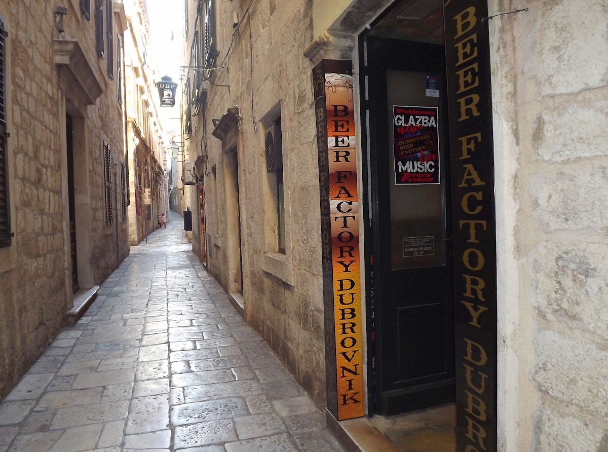 The poker-face entrance of Dubrovnik Beer Factory hides a splendid interior
