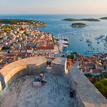 Hvar Town and tourists at Hvar Spanish Fort (Fortica) at sunset, Hvar Island, Dalmatian Coast, Adriatic, Croatia, Europe