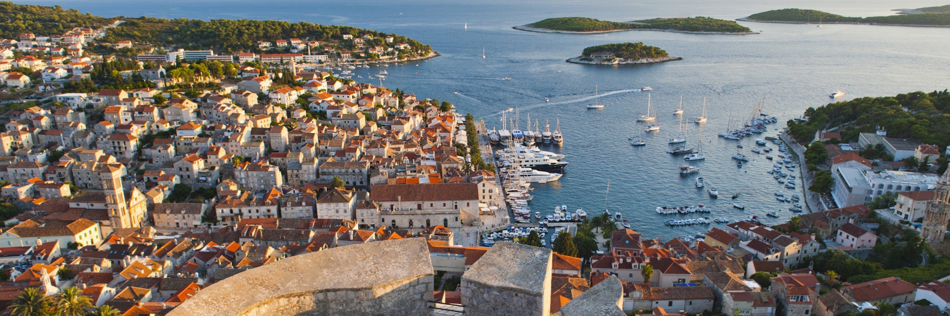 Hvar Town and tourists at Hvar Spanish Fort (Fortica) at sunset, Hvar Island, Dalmatian Coast, Adriatic, Croatia, Europe