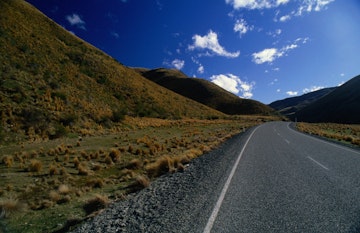 The barren landscape of Lindis Pass, the shortest route between Christchurch and Queenstown.