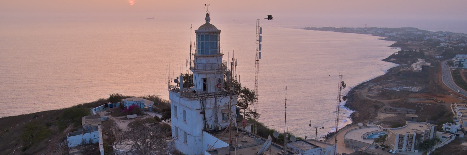 The lowest shutter speed I have ever shot during a KAP session at 1/250. Turned out well and had many keepers, but this photograph is the only one worthy of upload...About ten minutes after this shot, they turned the lights on. There was still a bit of ambient light, so now I wonder what 1/150 or 1/100 would do while the light is on?l..www.unc.edu/~rowlett/lighthouse/sen.htm..Image was captured by a camera suspended by a kite line. Kite Aerial Photography (KAP)