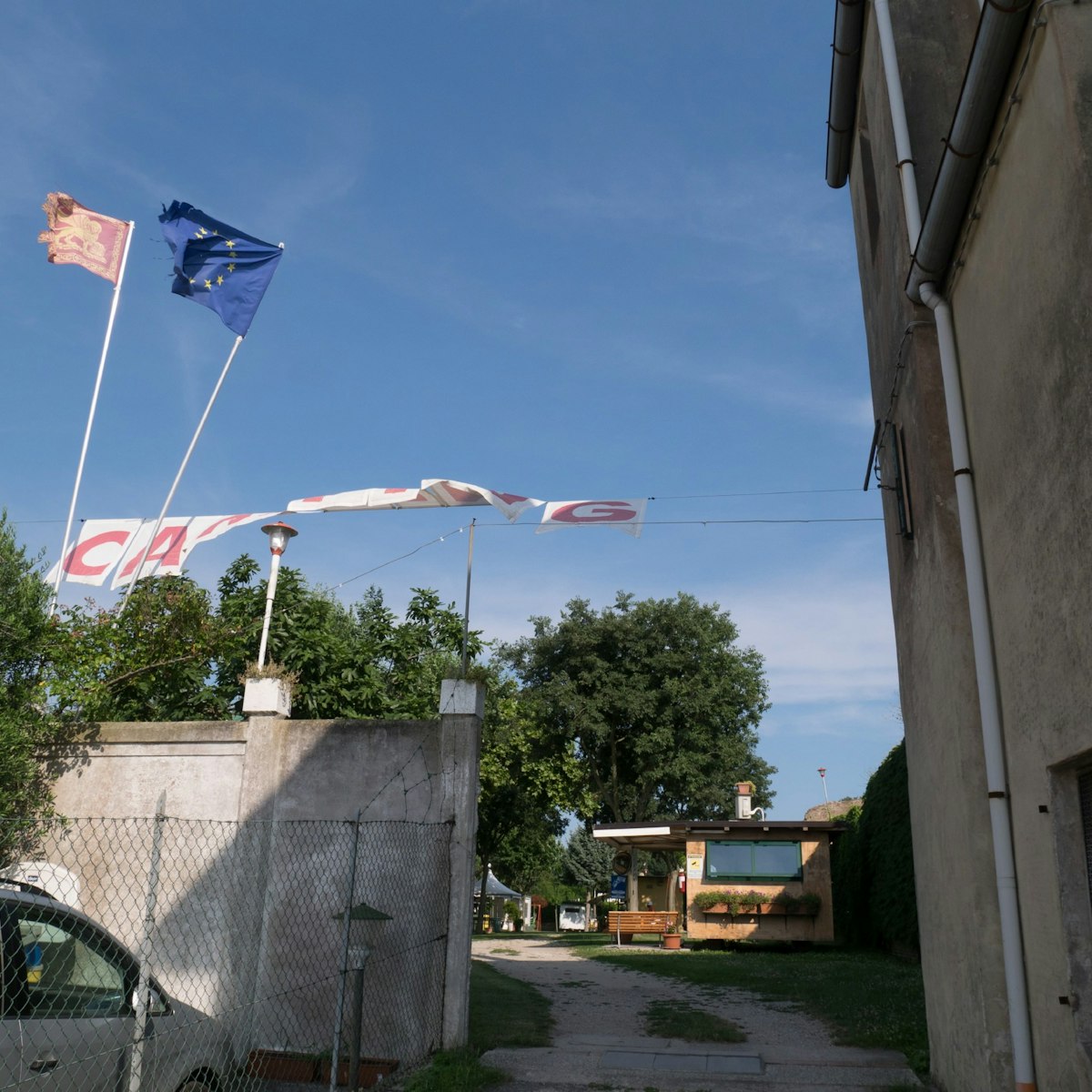 Bunting and flags signpost the entrance to the Camping San Nicolò campsite