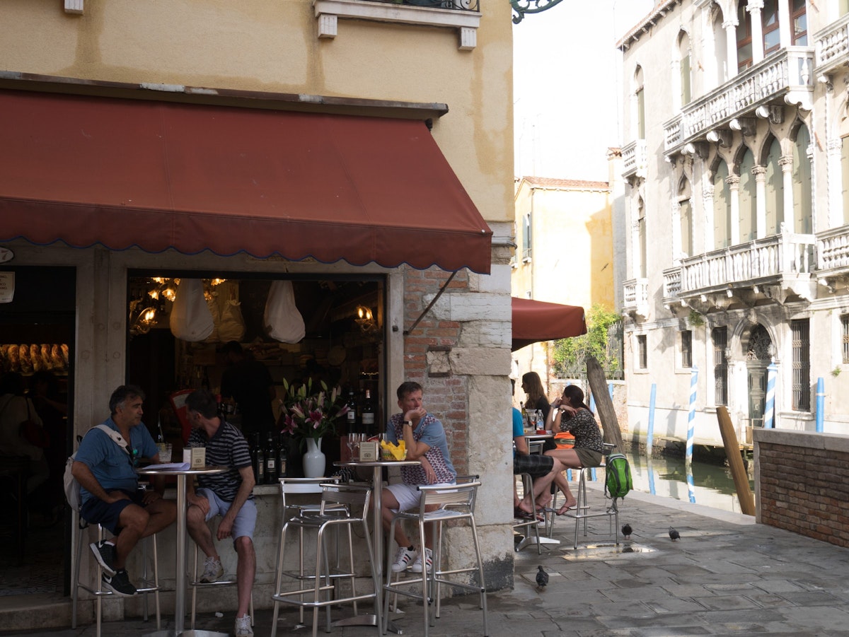 Guests enjoy a drink outside La Bottiglia