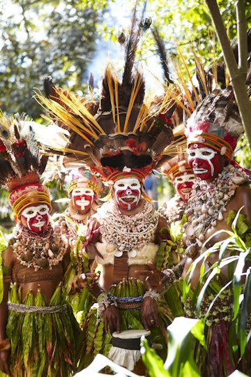 Women near Mount Hagen wearing ceremonial costume made of shells and feathers.