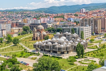 PRISTINA, KOSOVO - JULY 01, 2015: Aerial view of capital city with some old buildings like National Public Library and Christ the Saviour Cathedral.; Shutterstock ID 311334992; Your name (First / Last): Brana V; GL account no.: 65050; Netsuite department name: Online Editorial; Full Product or Project name including edition: Kosovo BiE 2018