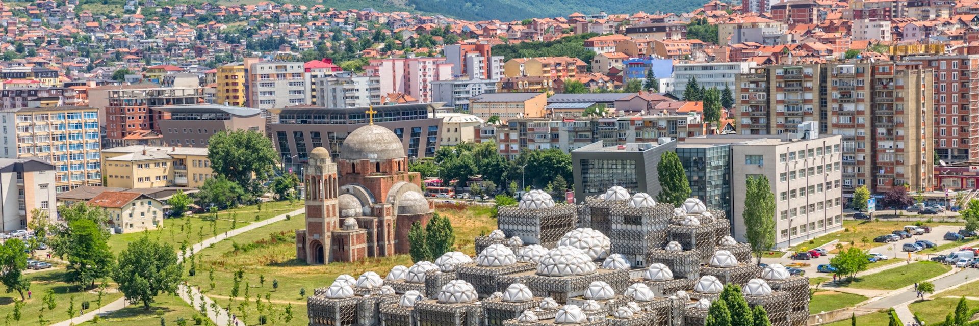 PRISTINA, KOSOVO - JULY 01, 2015: Aerial view of capital city with some old buildings like National Public Library and Christ the Saviour Cathedral.; Shutterstock ID 311334992; Your name (First / Last): Brana V; GL account no.: 65050; Netsuite department name: Online Editorial; Full Product or Project name including edition: Kosovo BiE 2018