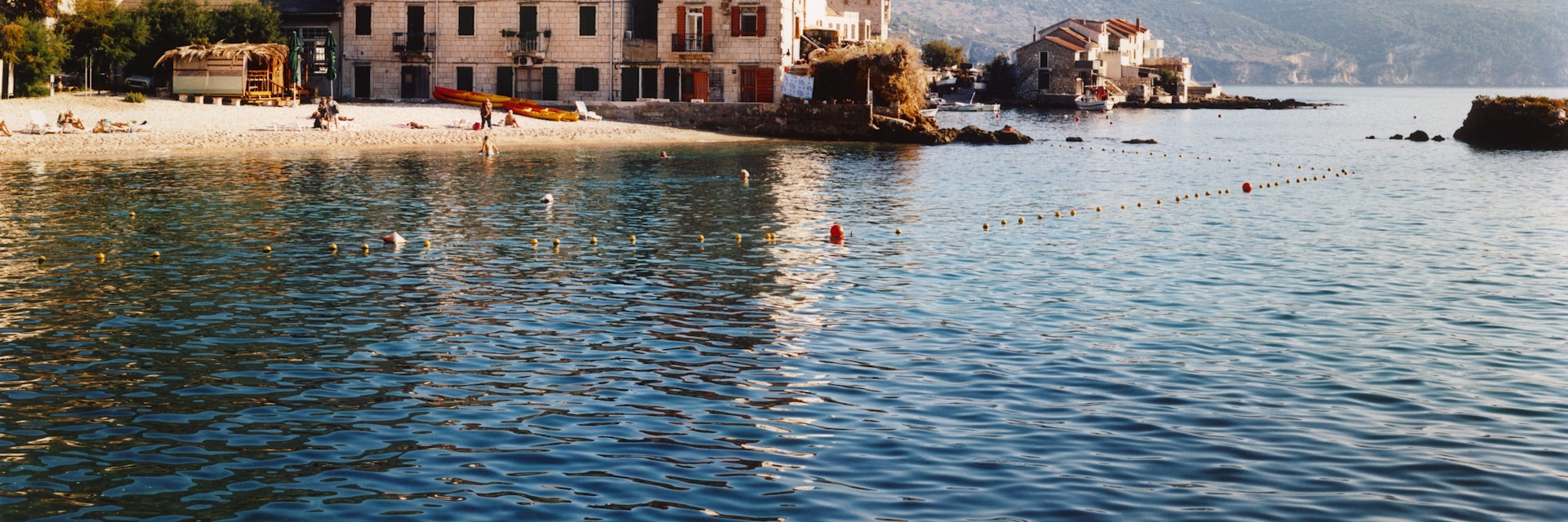 Komiza old town on coast at foot of Mount Hum.