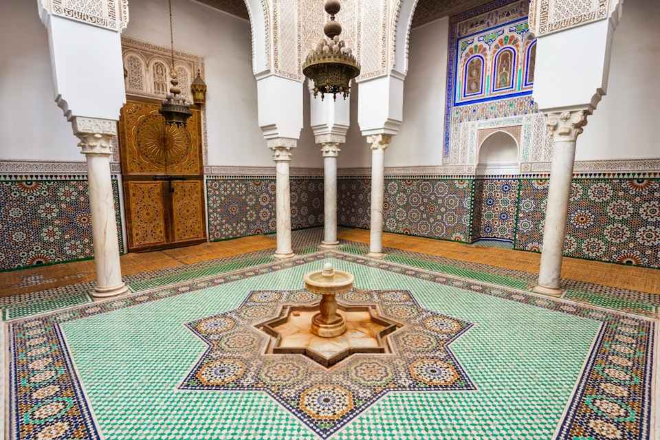 MEKNES, MOROCCO - FEBRUARY 29, 2016: Mausoleum of Moulay Ismail interior in Meknes in Morocco. Mausoleum of Moulay Ismail is a tomb and mosque located in the Morocco city of Meknes.; Shutterstock ID 421915627; Your name (First / Last): Lauren Keith; GL account no.: 65050; Netsuite department name: Online Editorial; Full Product or Project name including edition: Day in Meknes article