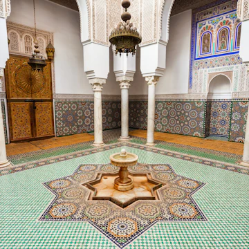 MEKNES, MOROCCO - FEBRUARY 29, 2016: Mausoleum of Moulay Ismail interior in Meknes in Morocco. Mausoleum of Moulay Ismail is a tomb and mosque located in the Morocco city of Meknes.; Shutterstock ID 421915627; Your name (First / Last): Lauren Keith; GL account no.: 65050; Netsuite department name: Online Editorial; Full Product or Project name including edition: Day in Meknes article