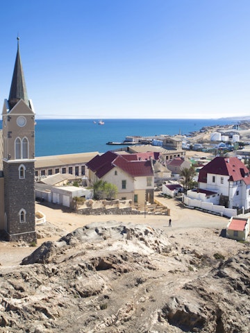View of Felsenkirche (church) and the coastal town of Luderitz with its colourful Germanic architecture, Namibia, Africa
