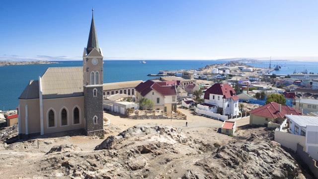 View of Felsenkirche (church) and the coastal town of Luderitz with its colourful Germanic architecture, Namibia, Africa