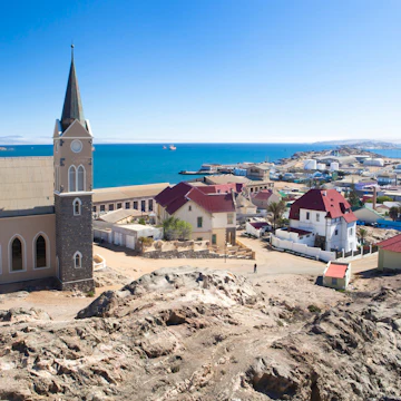 View of Felsenkirche (church) and the coastal town of Luderitz with its colourful Germanic architecture, Namibia, Africa