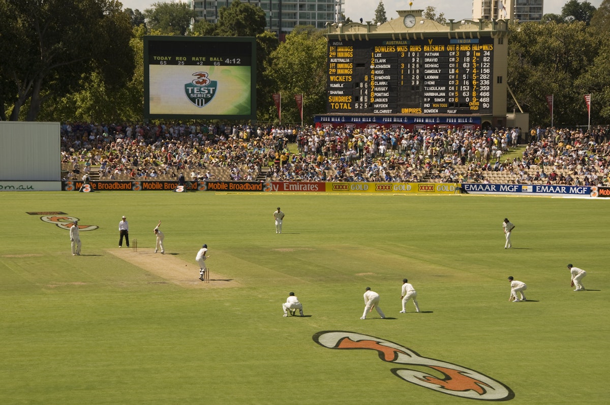 Test cricket match at the Adelaide Oval with the heritage scoreboard in background.
