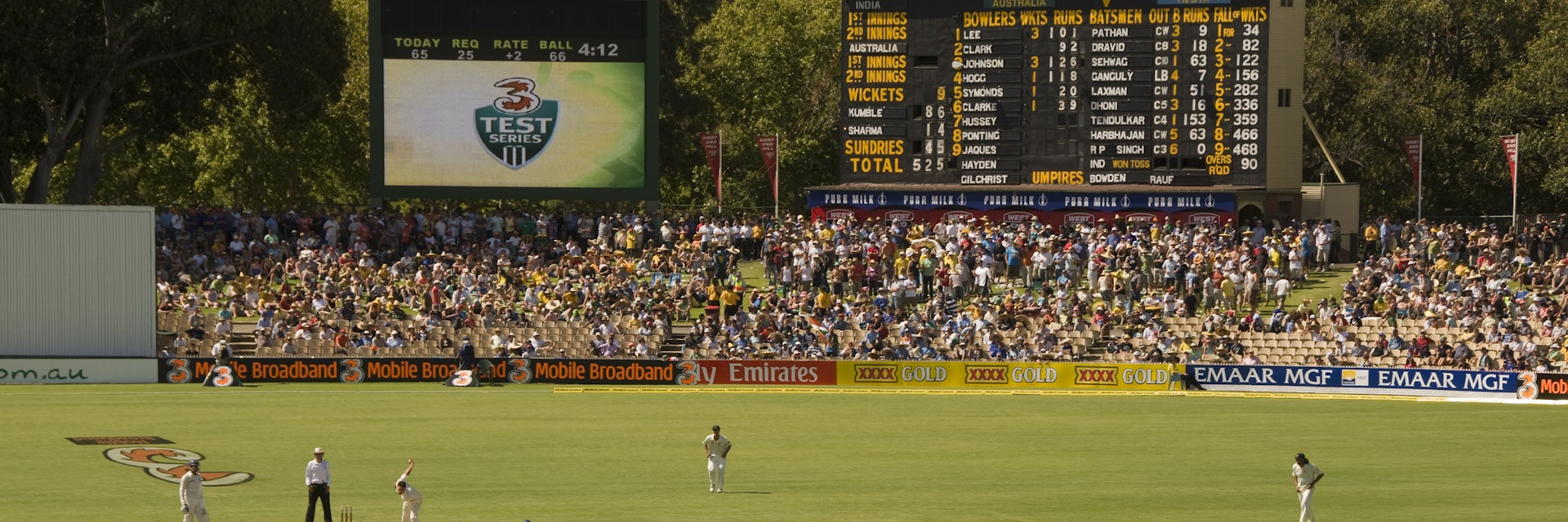 Test cricket match at the Adelaide Oval with the heritage scoreboard in background.