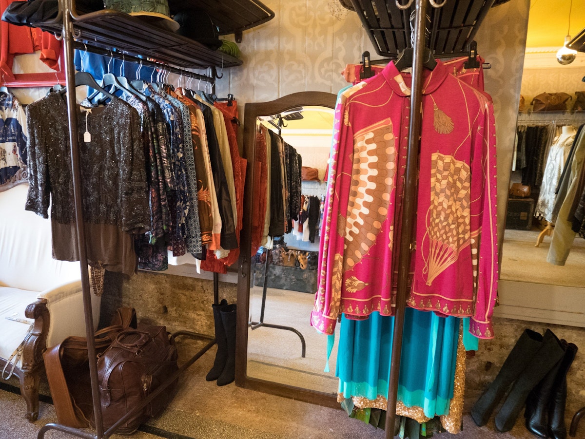 Brightly coloured clothing hangs in the Bisnonni store