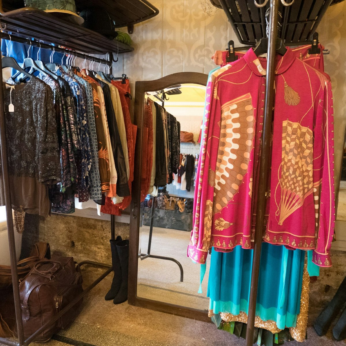 Brightly coloured clothing hangs in the Bisnonni store