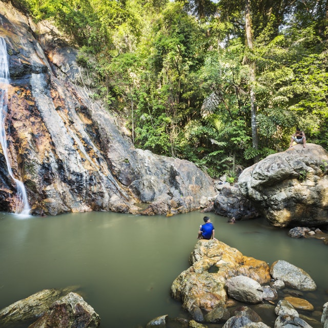Bathers at Nam Tok Na Muang waterfall.