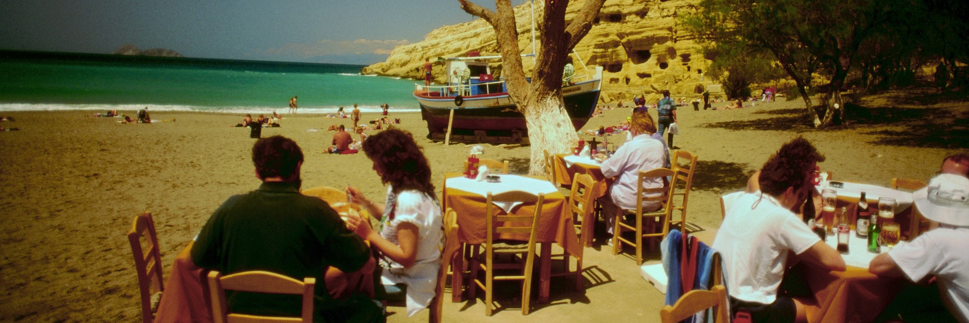 Dining at sunset on the beach beneath the caves - Matala, Iraklio Province, Crete