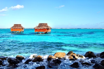 Two sea huts in the bay at Canouan in the Grenadines