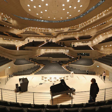 HAMBURG, GERMANY - NOVEMBER 04: Visitors walk through the large hall of the newly-completed Elbphilharmonie concert hall on November 4, 2016 in Hamburg, Germany. Designed by the archiecture firm Herzog and de Meuron and begun in 2007, the Elbphilharmonie was originally slated to be completed by 2010 at a cost of EUR 241 million. Instead it was finally finished on October 31, 2016 at a cost of EUR 789 million. Germany has been burdened with a string of high-profile construction projects whose completion has been years delayed and whose costs have ballooned. The first public concert at the Elbphilharmonie is scheduled for January 11, 2017 as part of its official opening. (Photo by Sean Gallup/Getty Images)