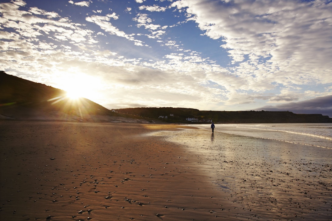 Deserted beach at sunrise.