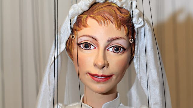 Maria, from The Sound of Music, in wedding dress at the Salzburger Marionettentheater.